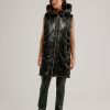 NIKKI JONES Quilted Shiny Long Hooded Vest In Black Athelisure